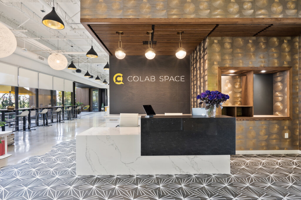 Front desk of Colab Space; a desk situated in an open-plan lobby